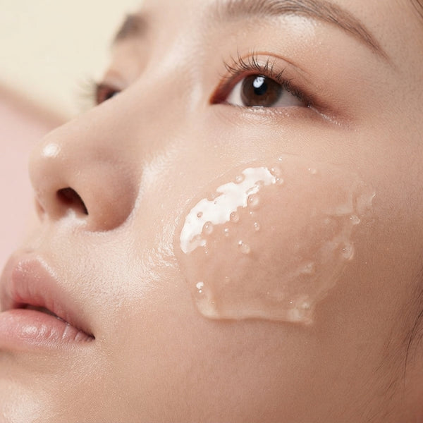 A close-up of serum sitting on the surface of skin, illustrating poor absorption of topical skincare products.